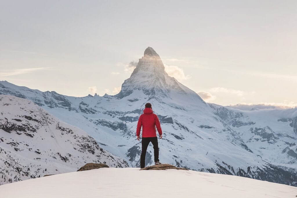 Hiker walking on mountain trail with views